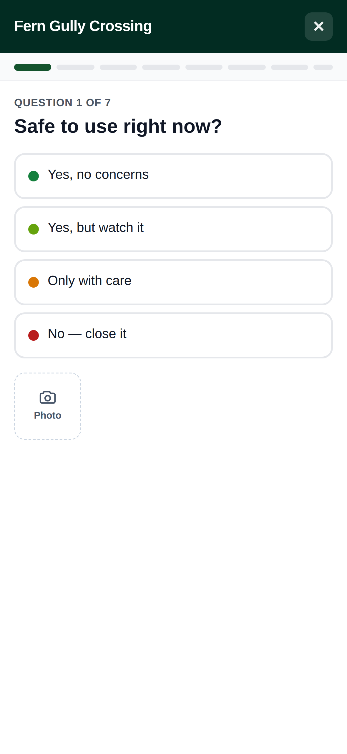One step of the inspection wizard: a question, its answers as full-width buttons, and the camera button below them